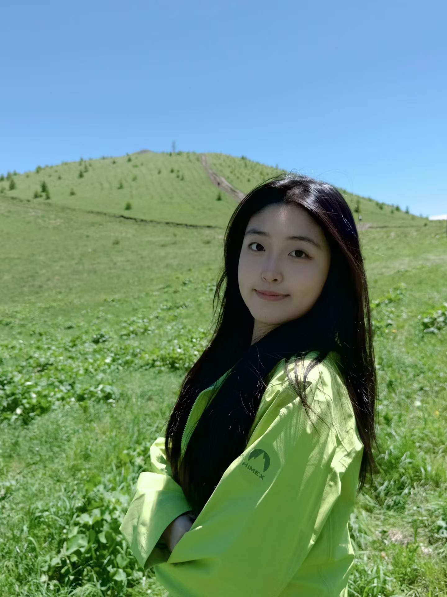 Bella Liu portrait in a green landscape