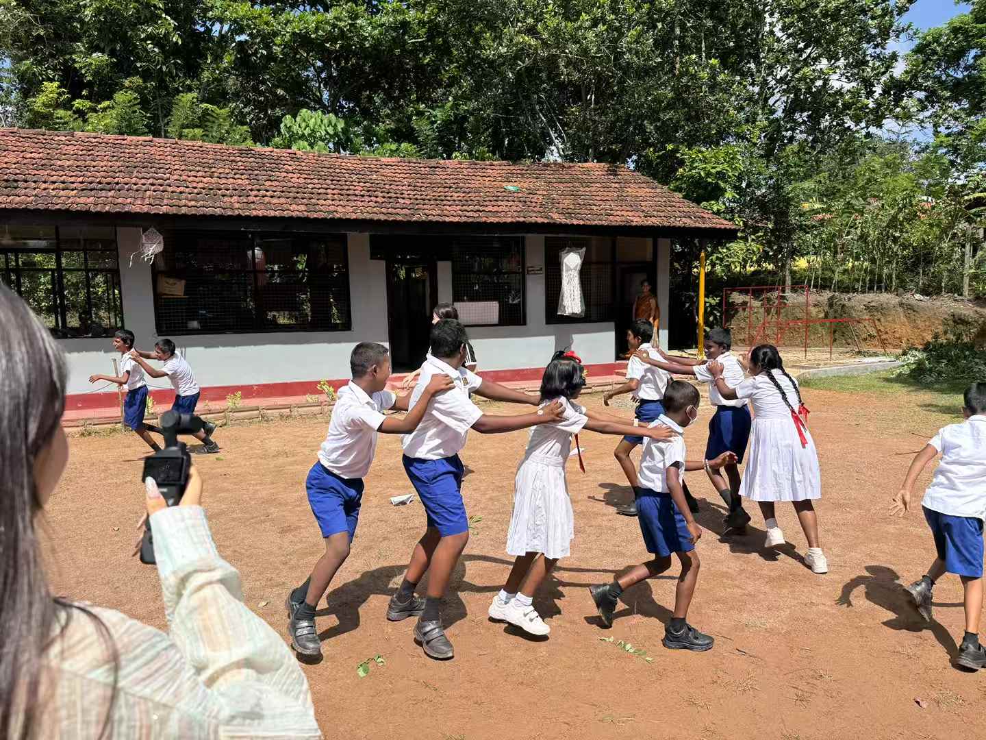 Students playing outdoors during a Sri Lanka teaching activity